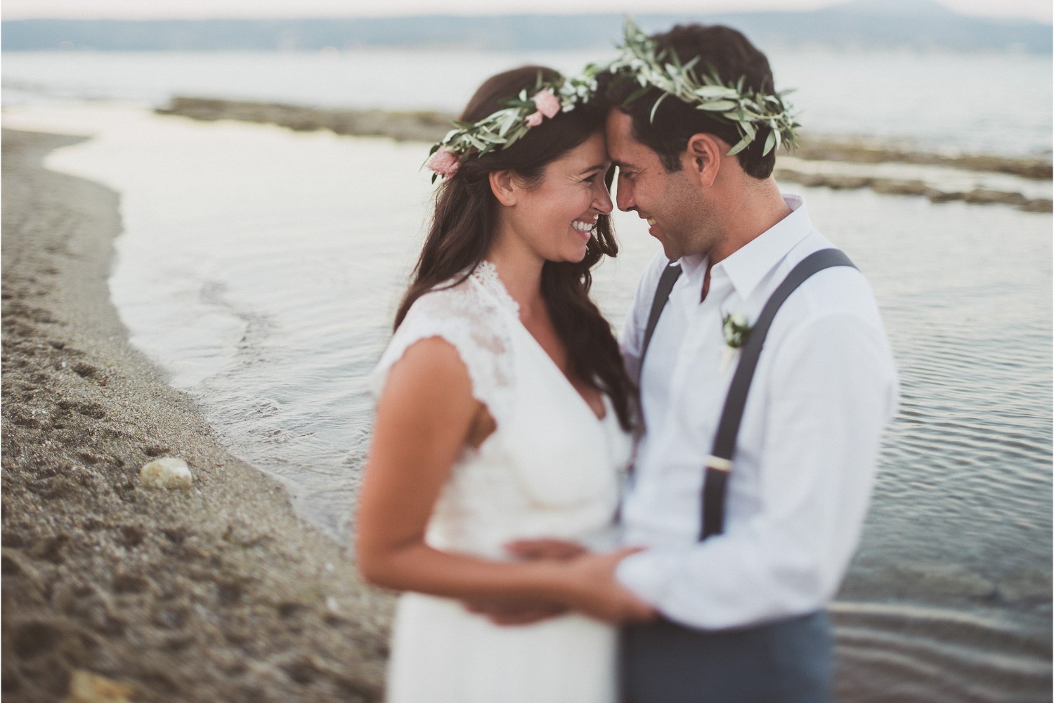 newlyweds at beach wedding ceremony in Crete