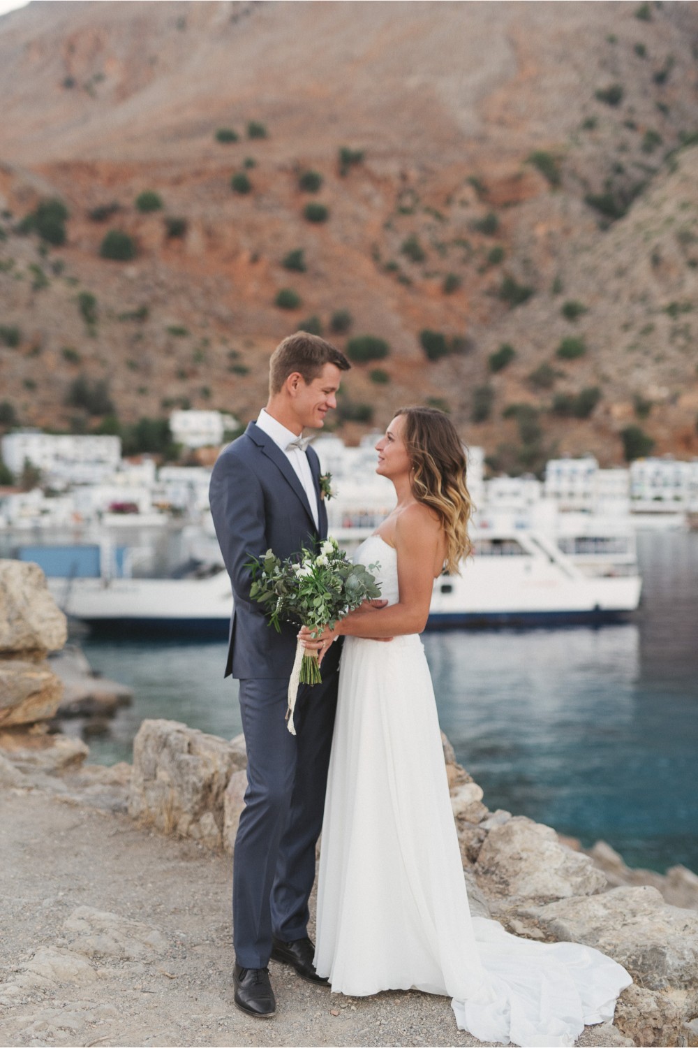 newlyweds at seaside wedding in Crete