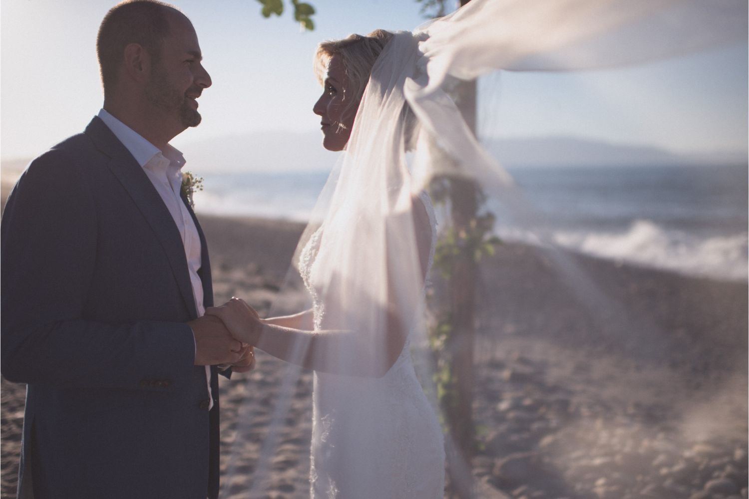 bride & groom at seaside wedding ceremony in Crete