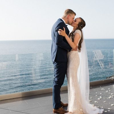 newlyweds kiss at private seaview villa