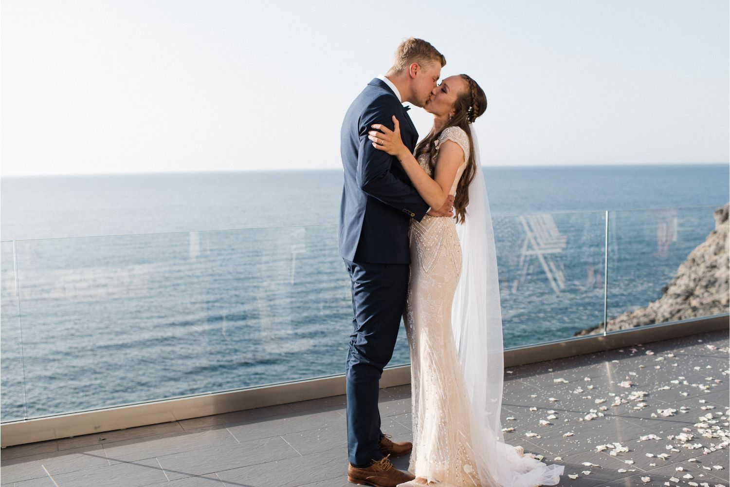 newlyweds kiss at private seaview villa