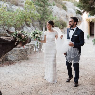 newlyweds and Greek donkey at Greek Orthodox wedding