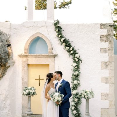 newlyweds at Greek Orthodox wedding ceremony in Crete