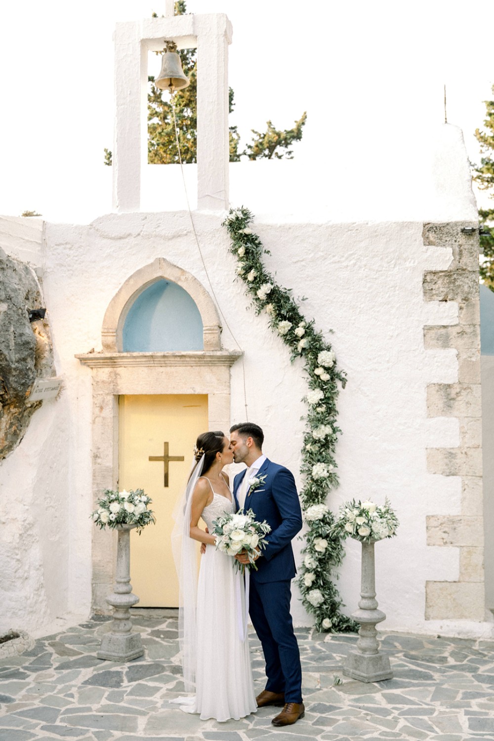newlyweds at Greek Orthodox wedding ceremony in Crete
