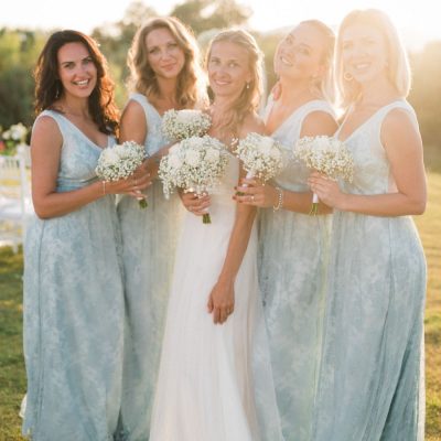 bride & bridesmaids at seaside villa wedding ceremony in Crete