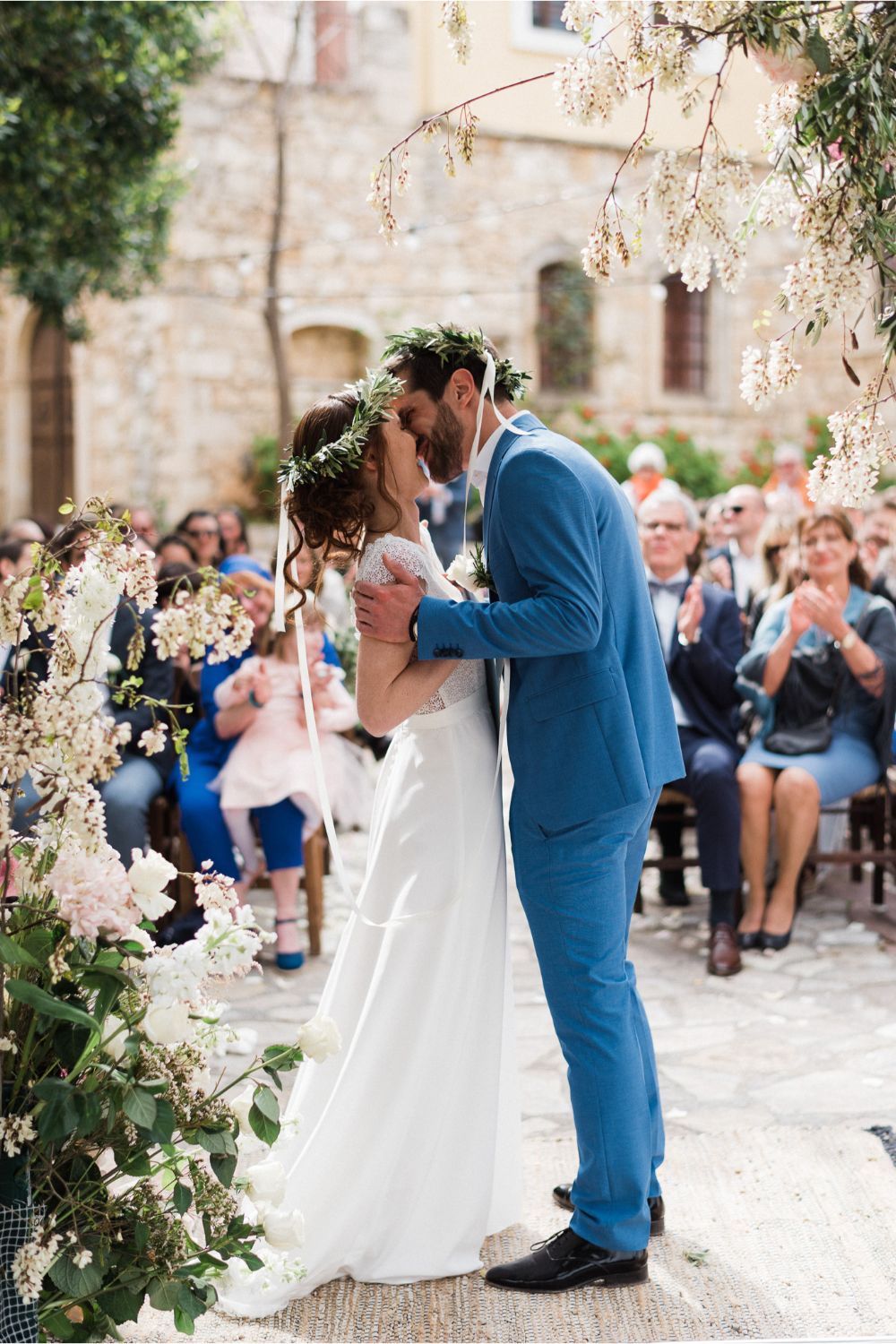 bride & groom first kiss at rustic wedding in Crete