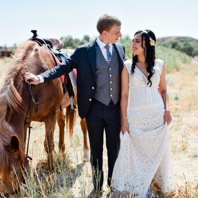 bride & groom photo session with horses before church wedding in Crete