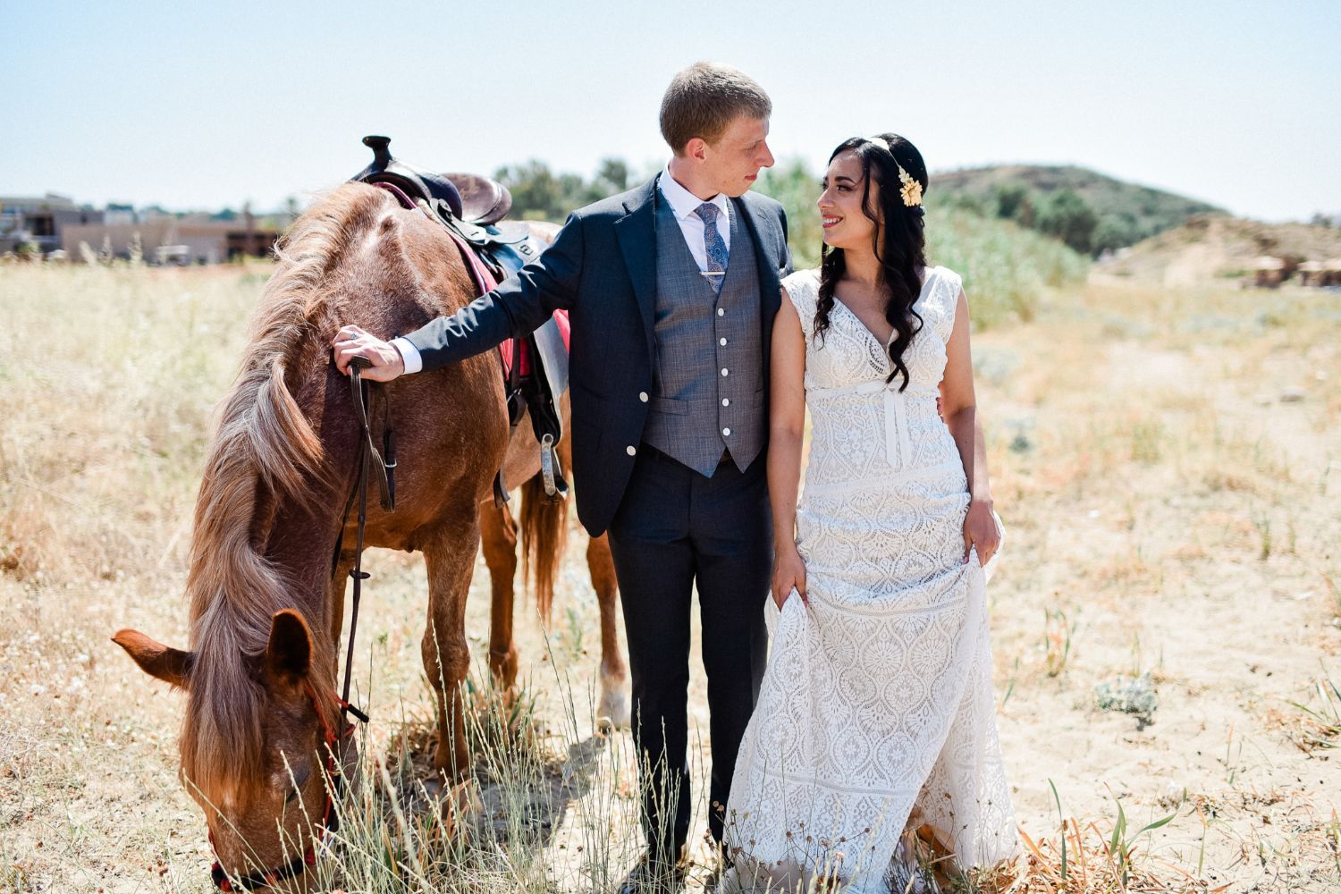 bride & groom photo session with horses before church wedding in Crete