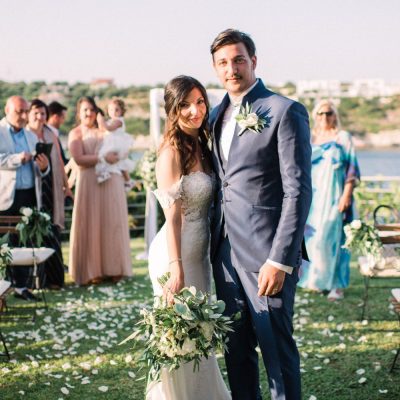 newlyweds at seaside wedding ceremony in Crete