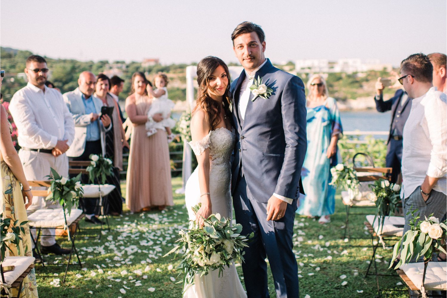 newlyweds at seaside wedding ceremony in Crete