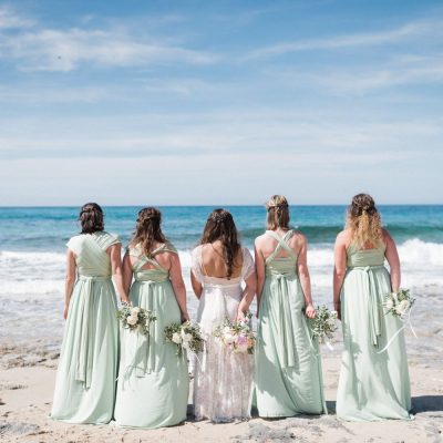 bride & bridesmaids at beach wedding in Crete