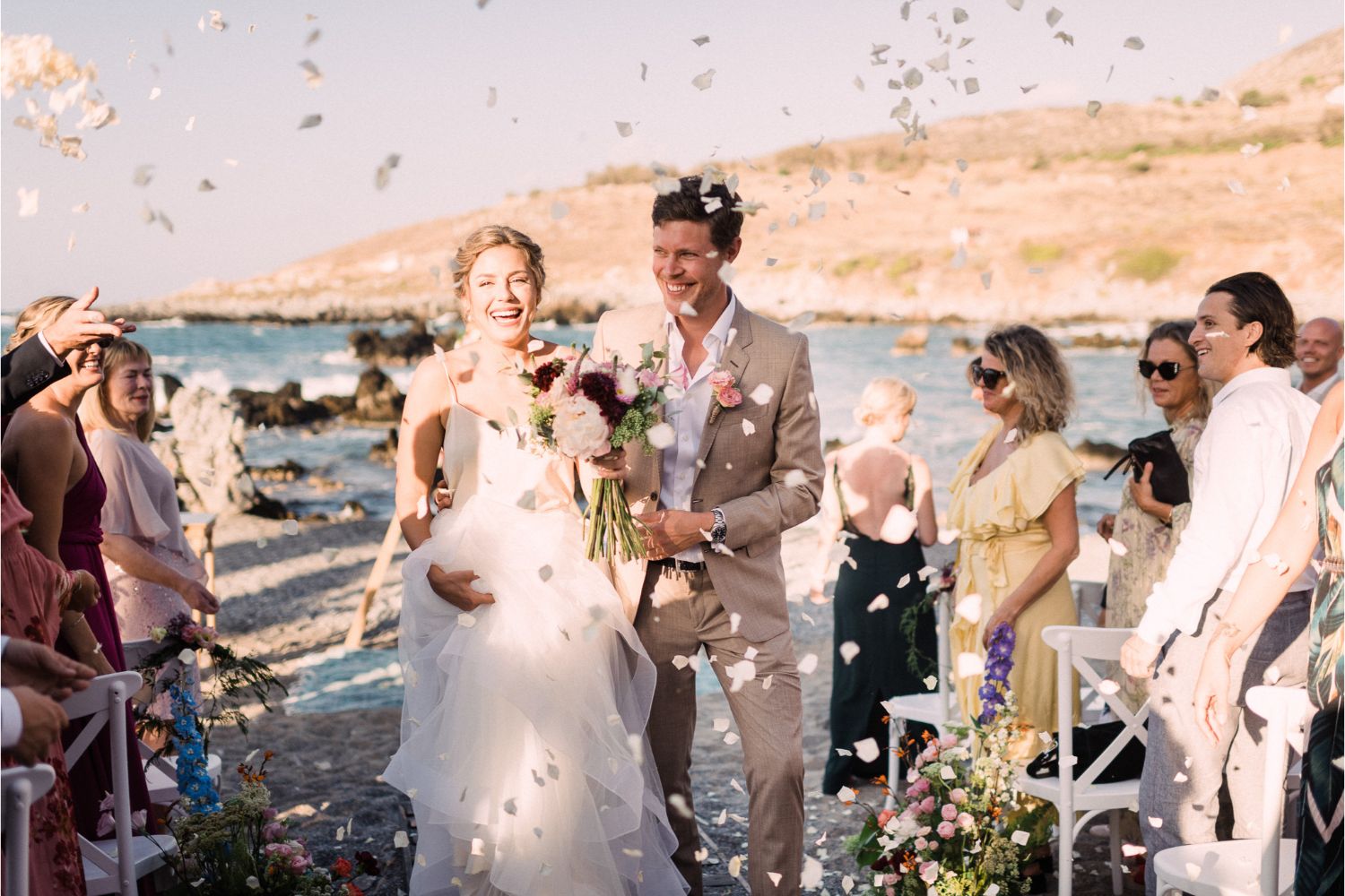 wedding recessional at seaside wedding ceremony in Crete