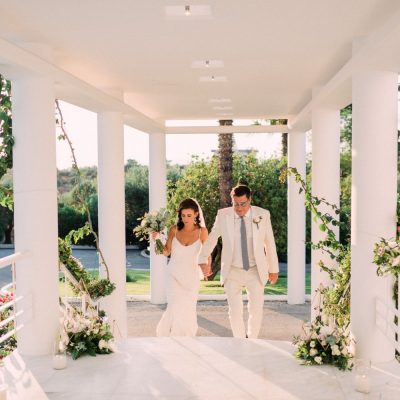 newlyweds entrance to villa wedding in Crete