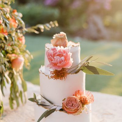 Three tier cake decorated with peonies